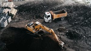 Dump truck and excavator at an industrial construction site in Istanbul, Turkey.