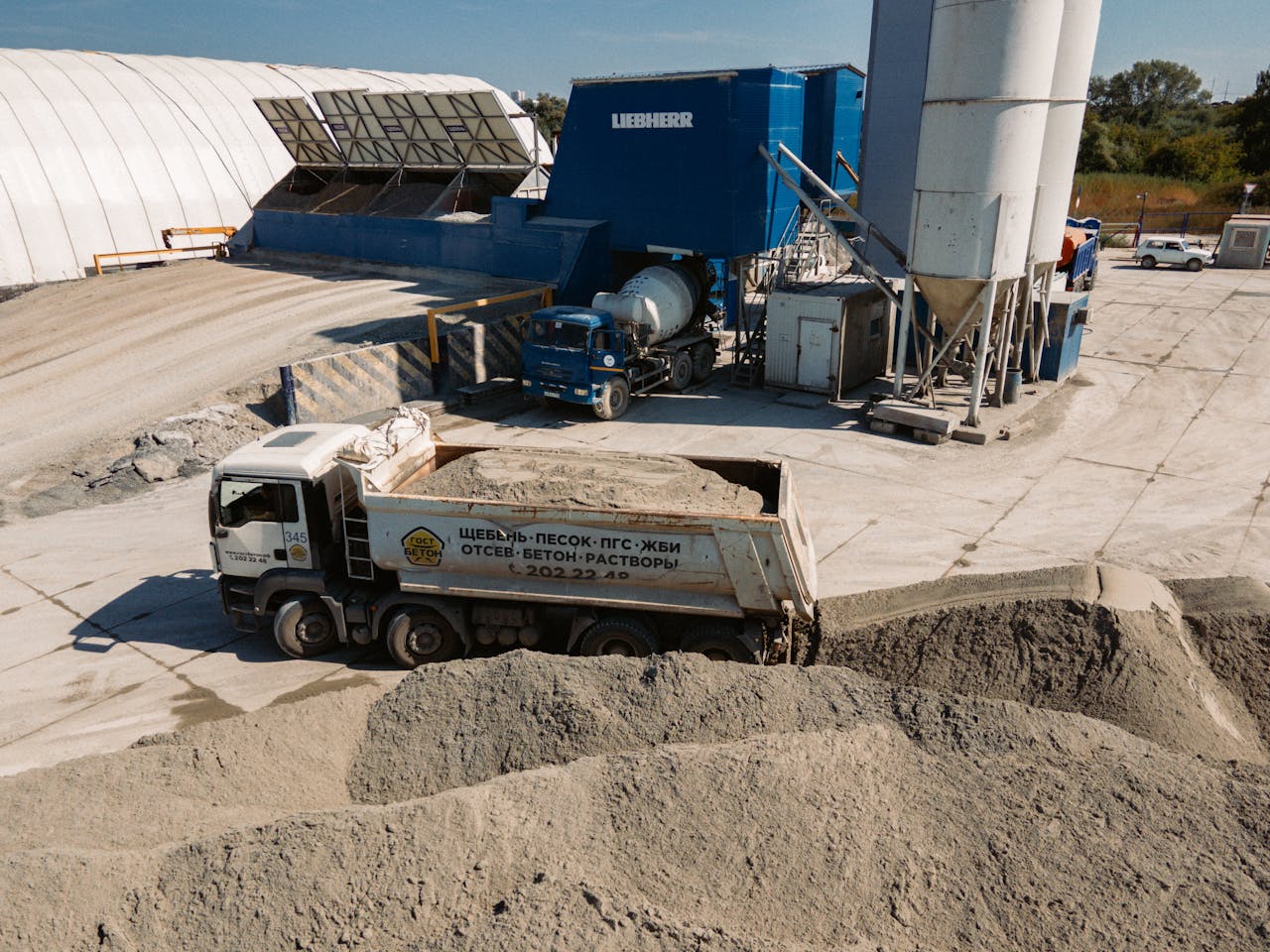 Aerial view of a concrete batching plant with dump truck in Novosibirsk, Russia.